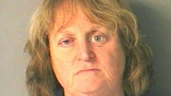 Nancy Bucciarelli is charged with cruelty to animals after pushing her dog into a lake and watching it drown.