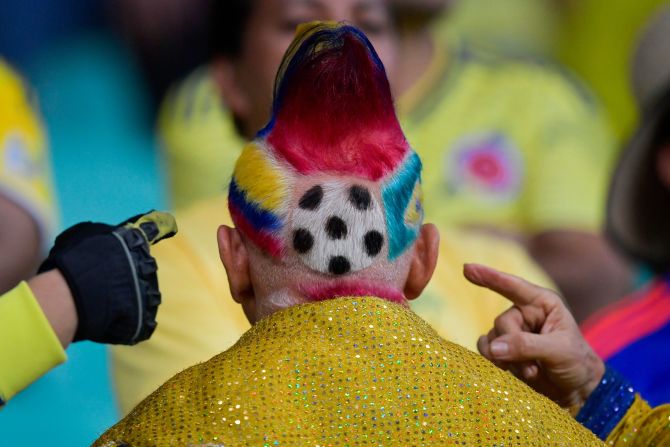 A Colombia soccer fan shows off his haircut before a Copa America match on Saturday, June 15.