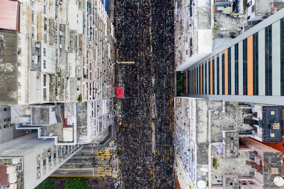 An overhead view shows thousands of protesters marching through a Hong Kong street on Sunday, June 16.