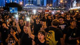 HONG KONG, HONG KONG - JUNE 16:  Protesters shine lights from their mobile phones during rally against a controversial extradition law proposal on June 16, 2019 in Hong Kong, China. Large numbers of protesters rallied on Sunday despite an announcement yesterday by Hong Kong's Chief Executive Carrie Lam that the controversial extradition bill will be suspended indefinitely. (Photo by Billy H.C. Kwok/Getty Images)