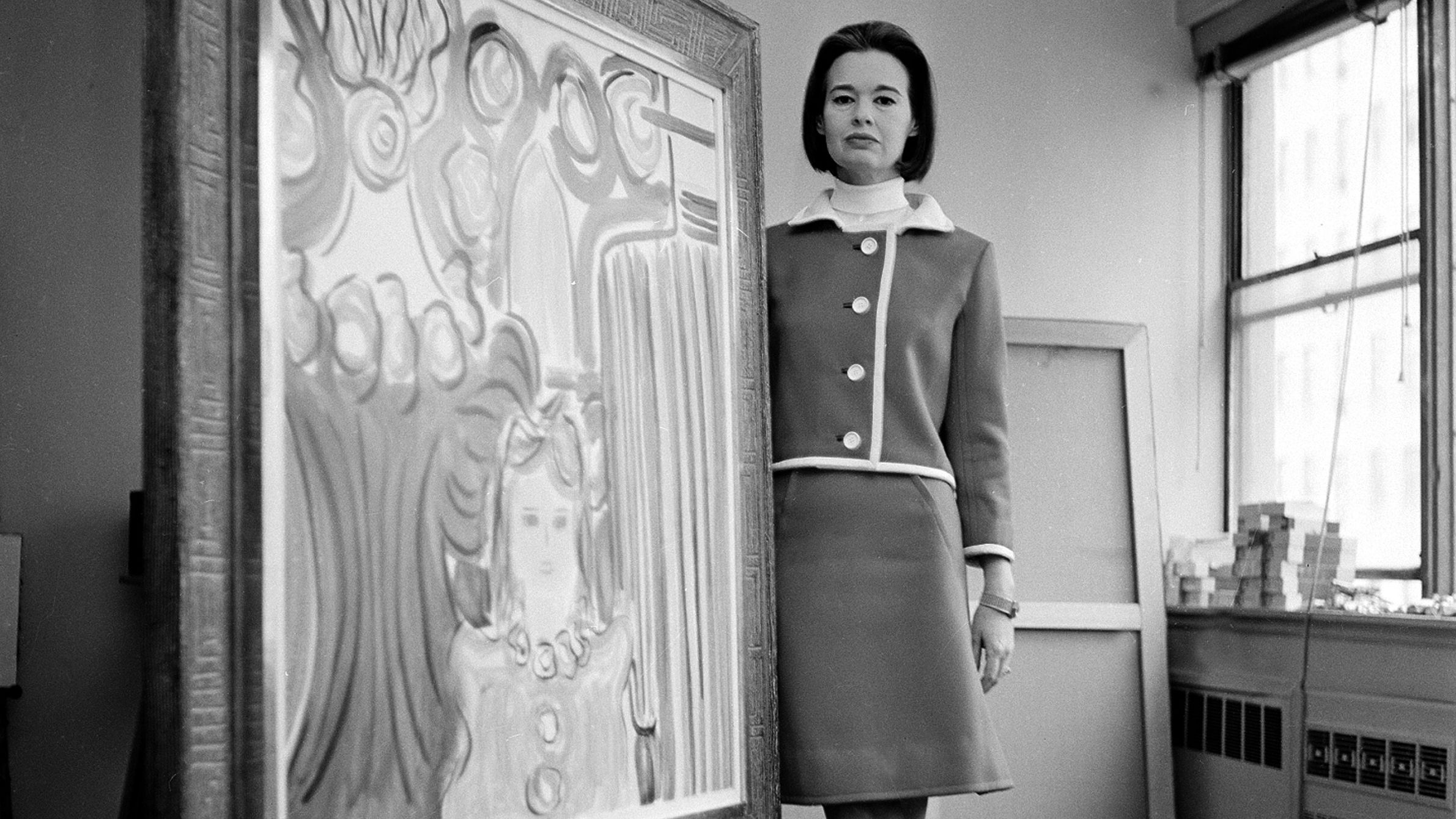 Vanderbilt poses with one of her paintings at her private studio in New York in 1966. She began exhibiting her artwork in the late 1940s.