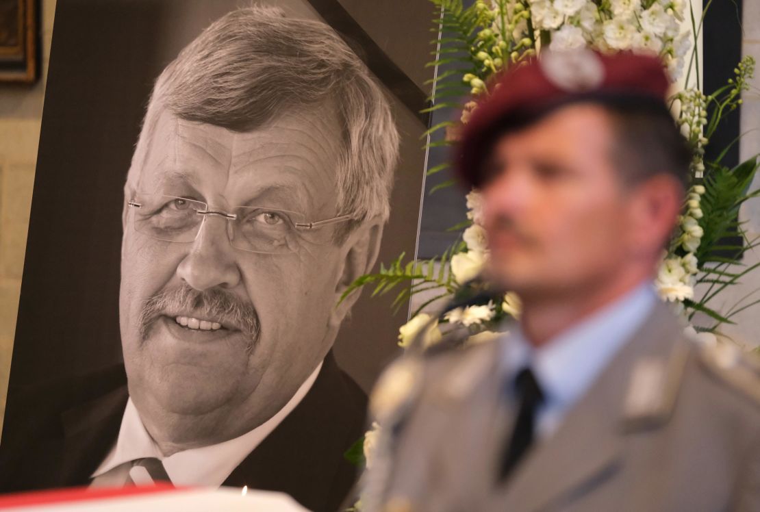 An honor guard stands at a portrait and coffin of murdered German politician Walter Lübcke at his memorial service on June 13.
