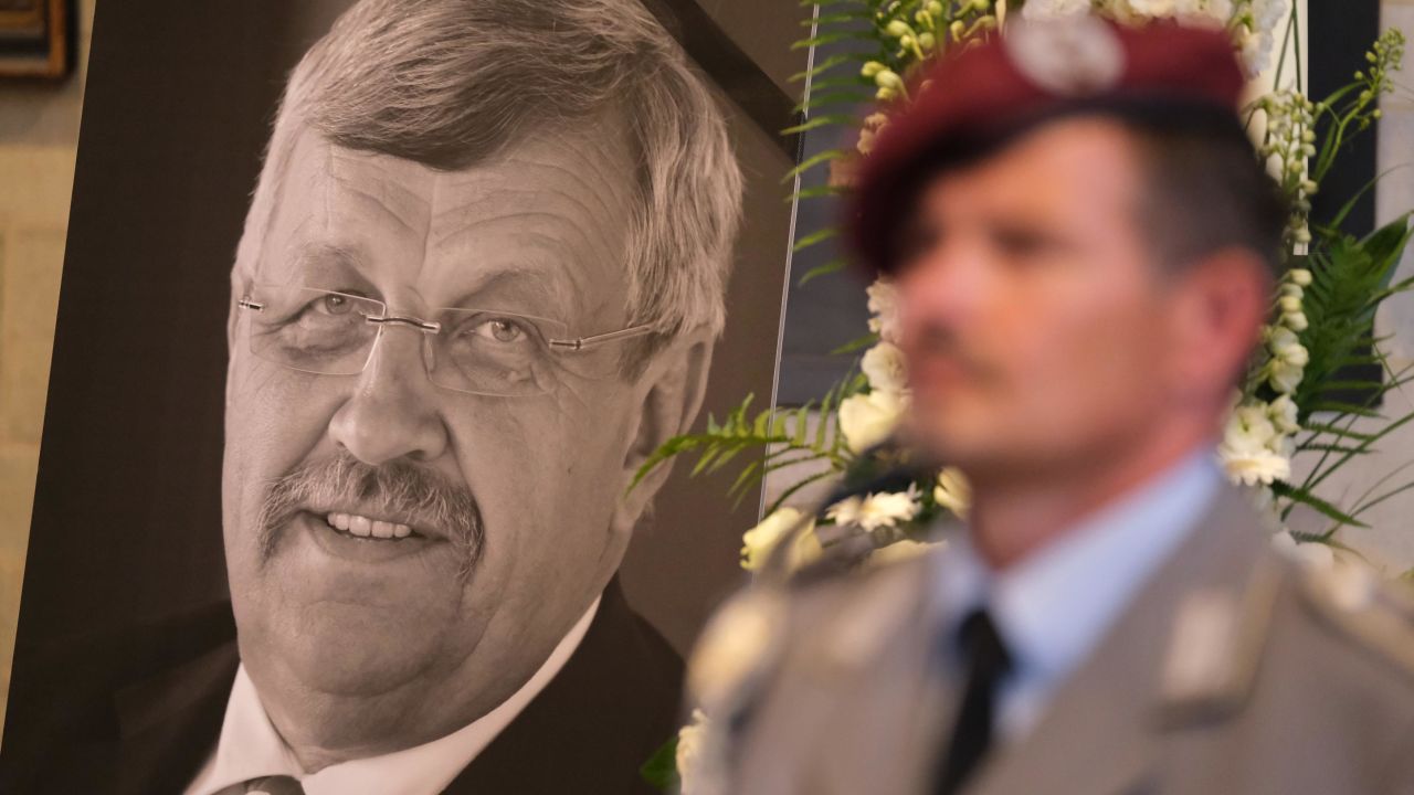 An honor guard stands at a portrait and coffin of murdered German politician Walter Lübcke at his memorial service on June 13.