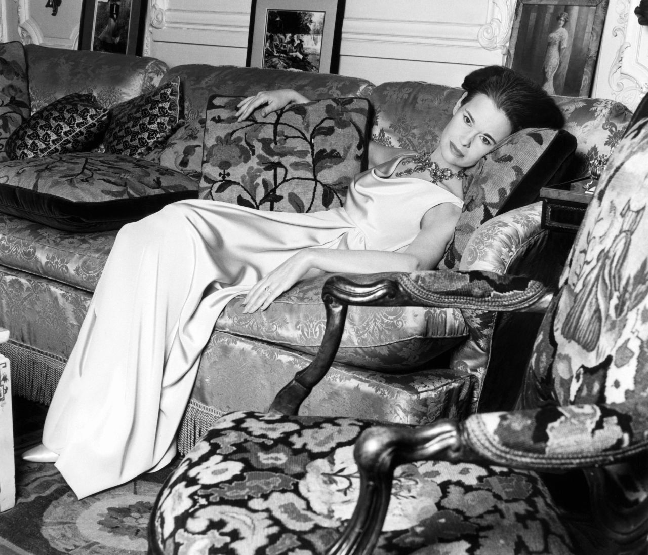Vanderbilt reclines on a couch for a Vogue magazine shoot in 1966.