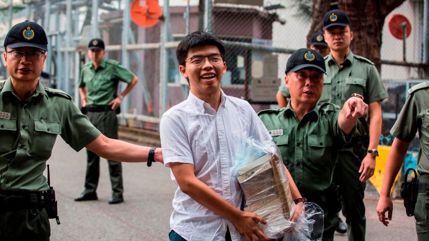 Hong Kong democracy activist Joshua Wong (C) leaves Lai Chi Kok Correctional Institute in Hong Kong on June 17, 2019. - Wong called on the city's pro-Beijing leader Carrie Lam to resign after he walked free from prison, as historic anti-government protests rocked the city. (Photo by ISAAC LAWRENCE / AFP) (Photo credit should read ISAAC LAWRENCE/AFP/Getty Images)