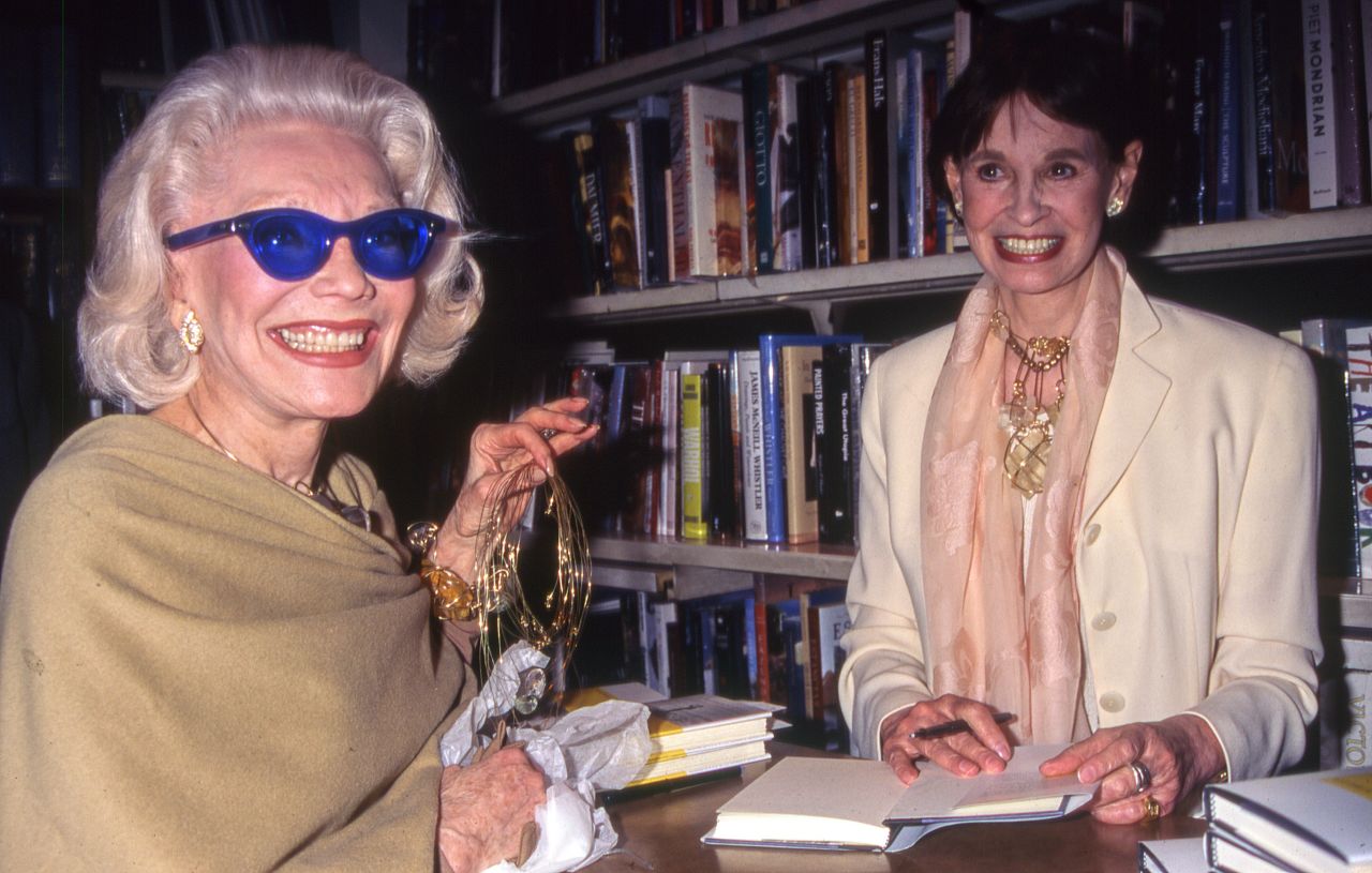 Vanderbilt signs a copy of her book for socialite Anne Slater. In 1996, Vanderbilt published "A Mother's Story" and talked about coping with life after her son's suicide.