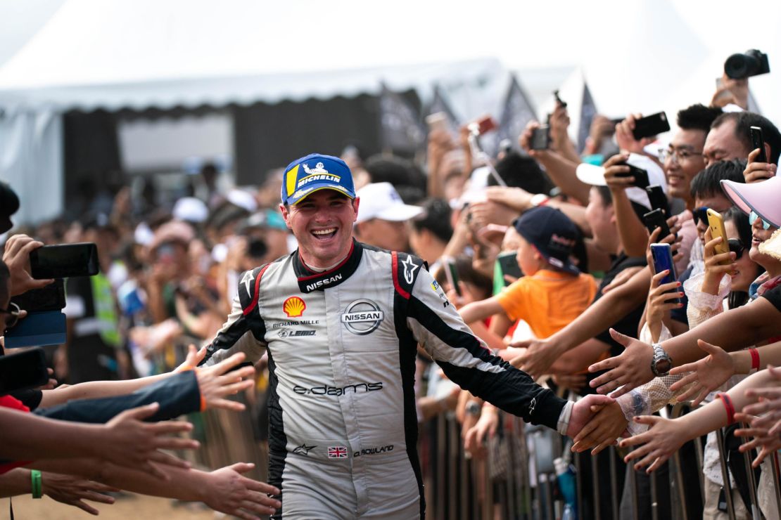 Oliver Rowland celebrates after scoring his first podium in Sanya
