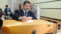 Mohammed Mursi, head of the Islamist Freedom and Justice Party, casts his ballot at a polling station in Zagazig city, 80 kms northeast of Cairo, on December 15, 2011 during the second round of parliamentary elections. (Photo/STR/AFP/GettyImages)