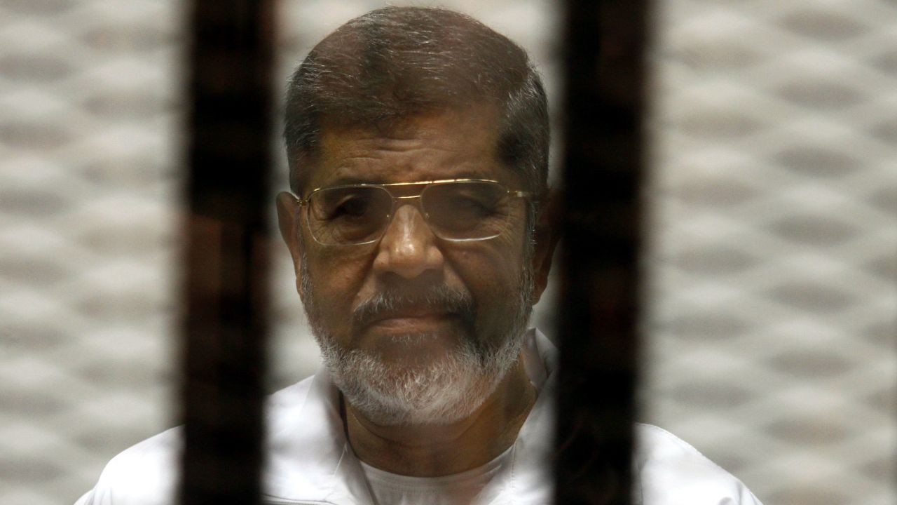 Morsy pictured in 2014 inside a defendant's cage.