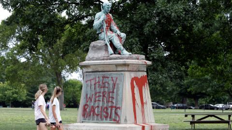 People walk past a monument to Confederate soldiers in Centennial Park on June 17 in Nashville.