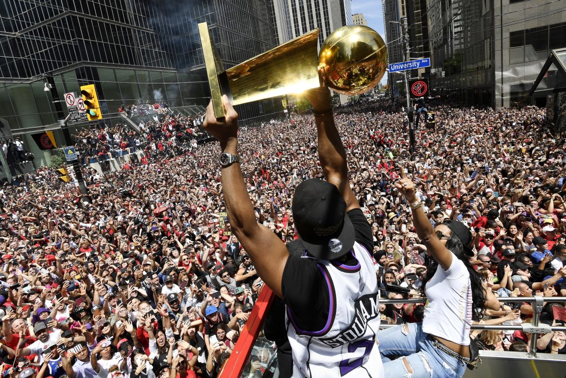The Toronto Raptors celebrate their first NBA championship with fans Monday.