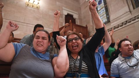 Supporters celebrate after the Green Light Bill was passed by the Senate Monday.