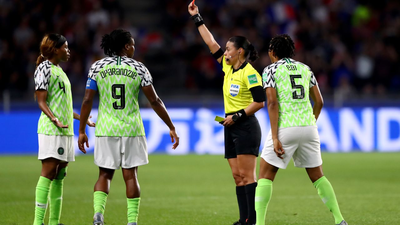 Referee Melissa Borjas shows Ebere a red card.