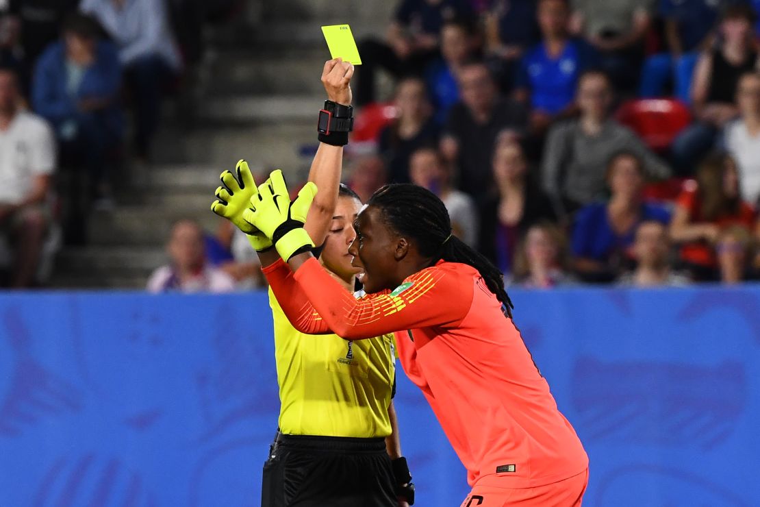 Nigeria's goalkeeper Nnadozie reacts as Honduran referee  Melissa Borjas decides France can re-take a penalty.