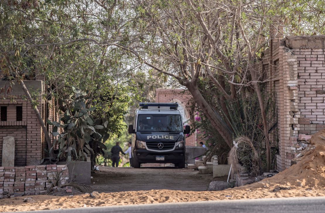 An Egyptian police vehicle is parked inside a cemetery in Nasr City after the former Egyptian President Mohamed Morsy was buried.