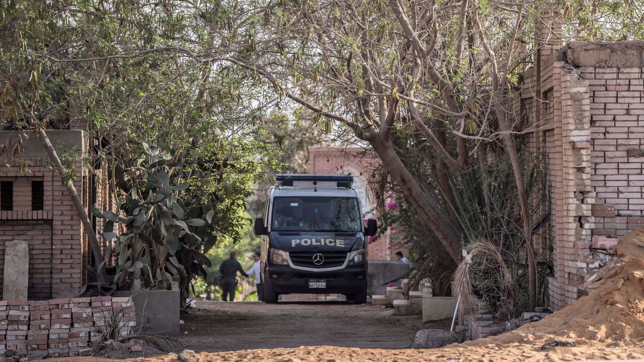 An Egyptian police vehicle is parked inside a cemetery in Nasr City after the former Egyptian President Mohamed Morsy was buried.