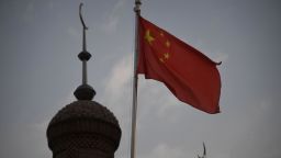 This photo taken on June 4, 2019 shows the Chinese flag flying over the Juma mosque in the restored old city area of Kashgar, in China's western Xinjiang region. - While Muslims around the world celebrated the end of Ramadan with early morning prayers and festivities this week, the recent destruction of dozens of mosques in Xinjiang highlights the increasing pressure Uighurs and other ethnic minorities face in the heavily-policed region. (Photo by GREG BAKER / AFP) / To go with AFP story China-politics-rights-religion-Xinjiang, FOCUS by Eva Xiao and Pak Yiu        (Photo credit should read GREG BAKER/AFP/Getty Images)