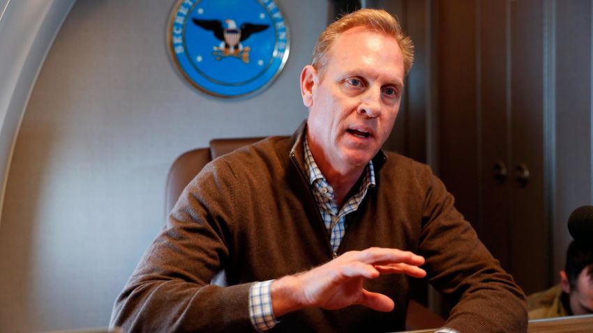 US Acting Secretary of Defense Patrick Shanahan gestures while speaking to members of the media aboard a military plane prior to his arrival at Andrews Air Force Base, Maryland, Saturday, February 23, 2019. Shanahan spoke about the US-Mexico border after visiting the El Paso, Texas area. (PABLO MARTINEZ MONSIVAIS/AFP/Getty Images)