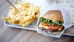 A ShackBurger, cheese fries, and milkshake are arranged for a photograph at a Shake Shack Inc. restaurant in Lexington, Kentucky, U.S., on Wednesday, March 6, 2019. Shake Shack is still failing to bring in more diners as it expands outside its home market of New York in the fiercely competitive restaurant space -- the chain plans to open 36 to 40 company-owned U.S. locations in fiscal 2019. Photographer: Luke Sharrett/Bloomberg via Getty Images