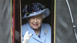 Britain's Queen Elizabeth looks out from a carriage in Windsor Great Park on her way to Royal Ascot horse race meeting in Ascot, England, Tuesday, June 18, 2019. (Steve Parsons/PA via AP)