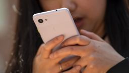 An attendee uses the Google LLC Pixel 3a XL smartphone during the Google I/O Developers Conference in Mountain View, California, U.S., on Tuesday, May 7, 2019. Each year, Google pitches new ways its trove of user data can improve apps, websites and other services on smartphones. This year, the internet giant will try to convince the world it's a responsible steward of all that information. Photographer: David Paul Morris/Bloomberg via Getty Images