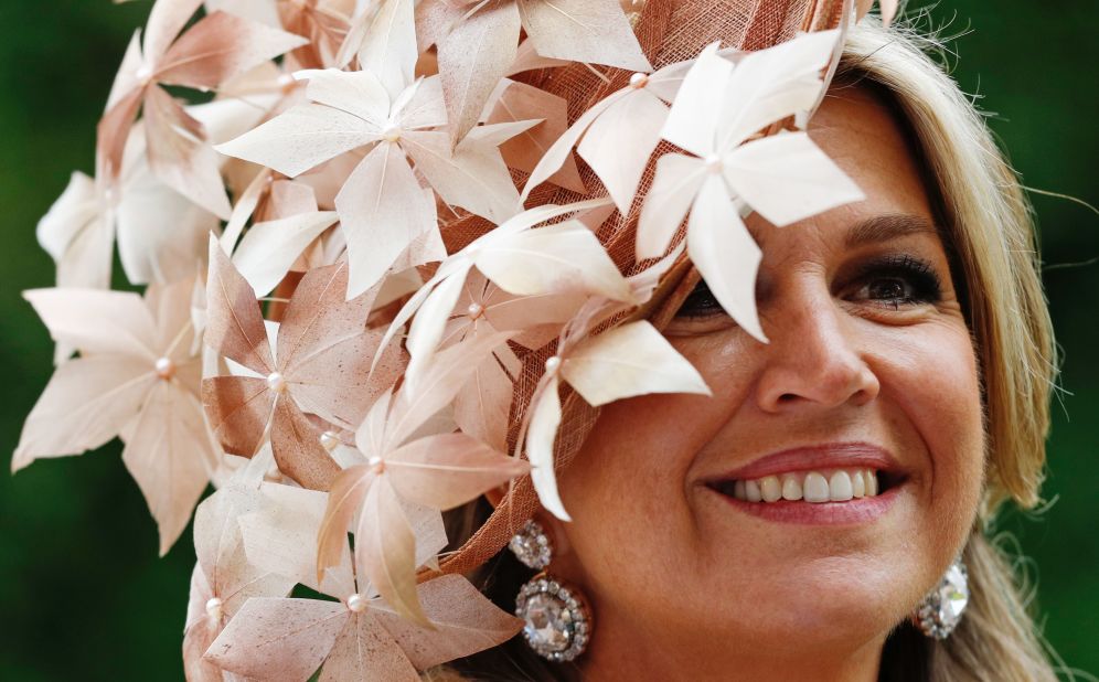 Queen Maxima is full of smiles as she waved to racegoers.