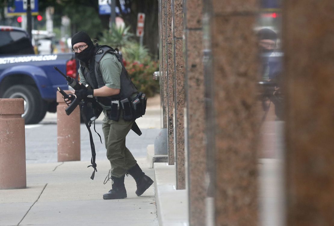 An armed shooter (shown) attacks at the Earle Cabell federal courthouse Monday morning, June 17, 2019 at the in downtown Dallas. Law enforcement returned fire and the shooter was hit by gunfire. No officers or citizens were injured. (Tom Fox/The Dallas Morning News) - 