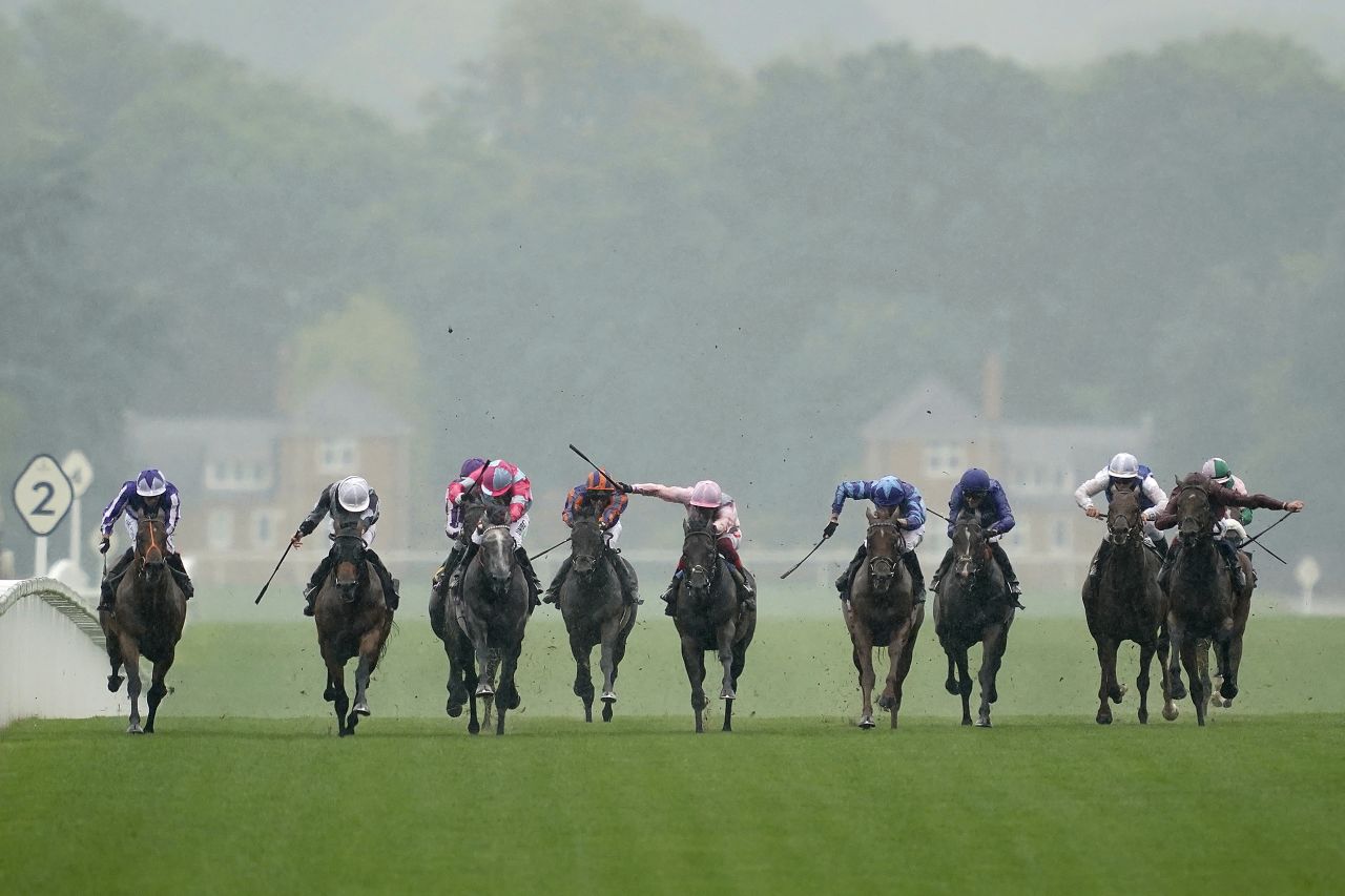 Ryan Moore rode Circus Maximus (second left, white cap) to victory in the showpiece St James's Palace Stakes ahead of the third-placed Frankie Dettori-trained favorite Too Darn Hot (in pink, center).