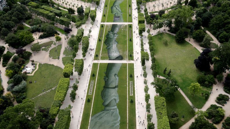 <strong>Paris:</strong> In June, "Beyond Walls" -- a biodegradable artwork by French street artist Saype -- was unveiled on the lawns of the Champs de Mars in Paris. The lawns lead up to the Eiffel Tower, which offered the best views of the work. 