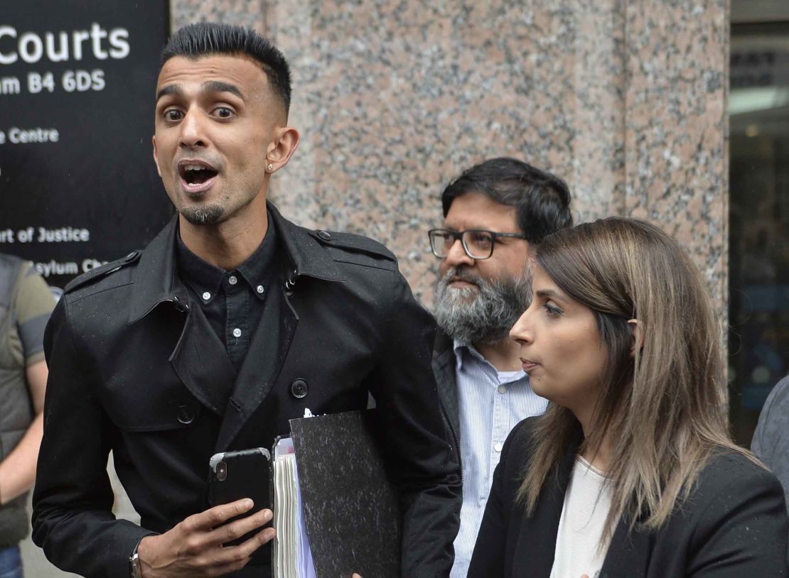 The injunction banned Amir Ahmed (2nd from right), one of the protest leaders, from entering the exclusion zone around the school.