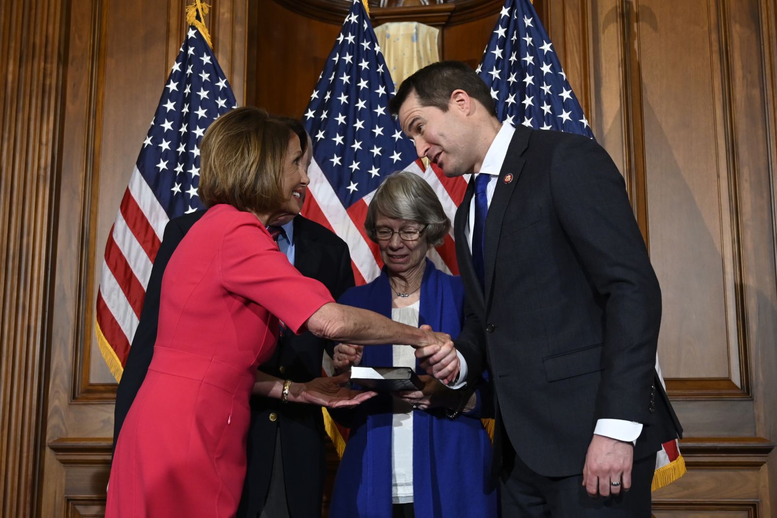 Moulton shakes hands with House Speaker Nancy Pelosi during his ceremonial swearing-in this year. Moulton in the past has tried to oust Pelosi from House Democratic leadership. But this time, he voted for her speakership.