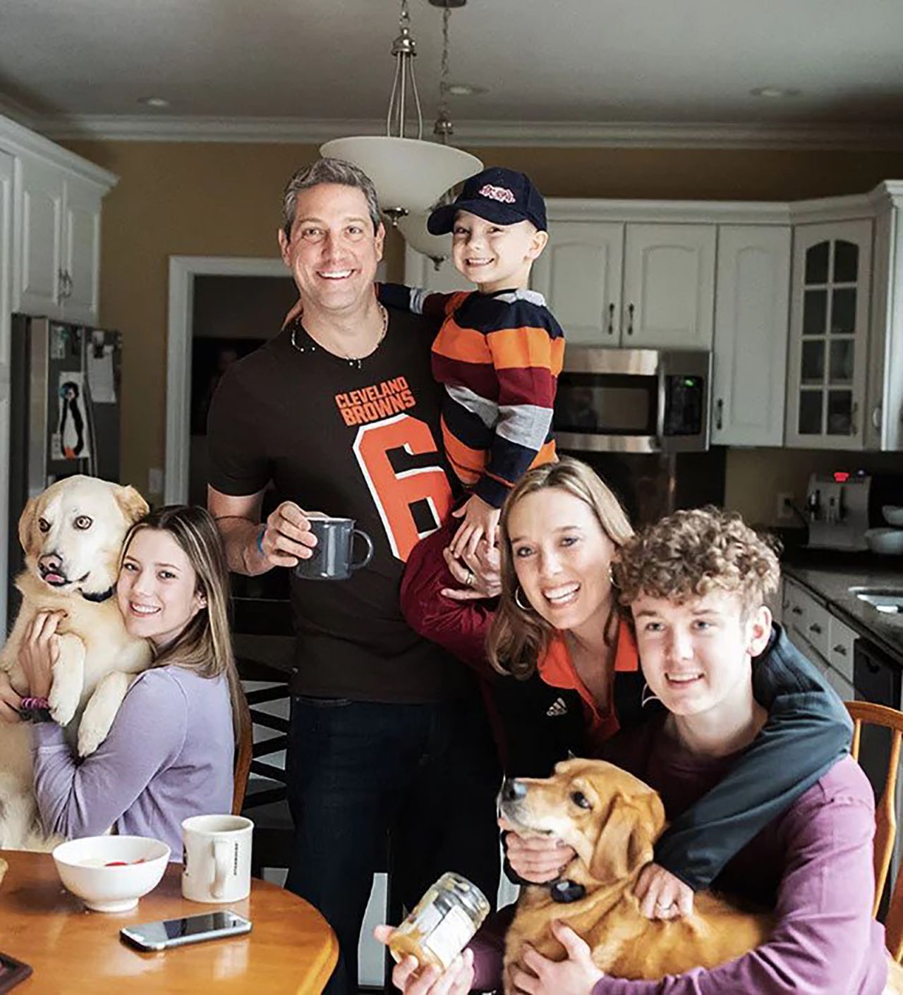 Ryan, his wife and their three children pose for a family portrait. In addition to Brady, Ryan is also raising two stepchildren, Bella and Mason. 