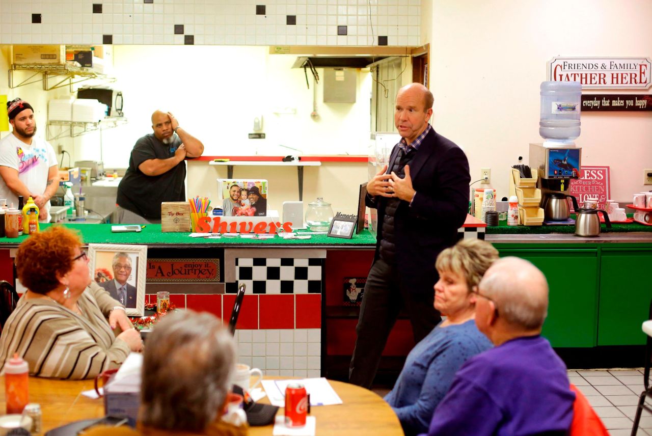 Delaney speaks with people at a restaurant during a campaign stop in Fort Dodge, Iowa, in January 2019.