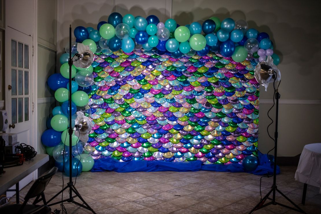 The photo booth at the prom had a mermaid-inspired backdrop.