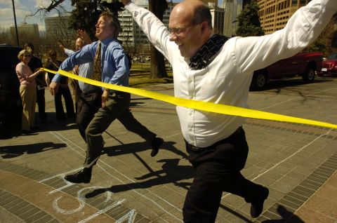 Hickenlooper and the mayors of Lakewood and Aurora, Colorado, compete in a 20-yard dash to promote the Colorado Colfax Marathon in April 2006.
