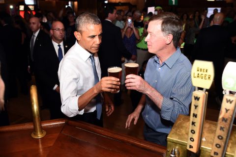 Hickenlooper shares a beer with President Barack Obama while Obama was in Denver in July 2014.