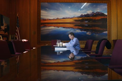 Hickenlooper has a quiet moment in his office between daily meetings in September 2014.