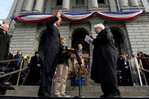 With his son by his side, Hickenlooper takes the oath of office for his second term as governor. Hickenlooper and his first wife, Helen, separated in 2012 and divorced in 2015.