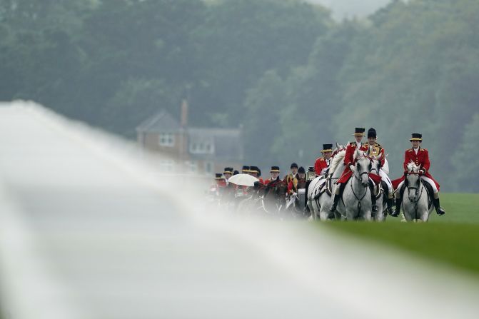 The Royal Procession makes its way down the Straight Mile at Royal Ascot ahead of racing.