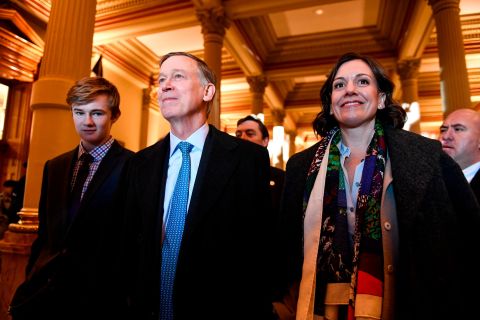 Hickenlooper is joined by his wife, Robin, and his son, Teddy, before the inauguration of his successor, Jared Polis, in January 2019.