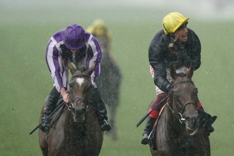 The heavens opened later Wednesday as Frankie Dettori rode Crystal Ocean (right) to victory in the showpiece Prince Of Wales's Stakes.