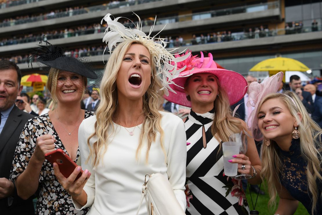 Racegoers cheer on the horses on day two of Royal Ascot.