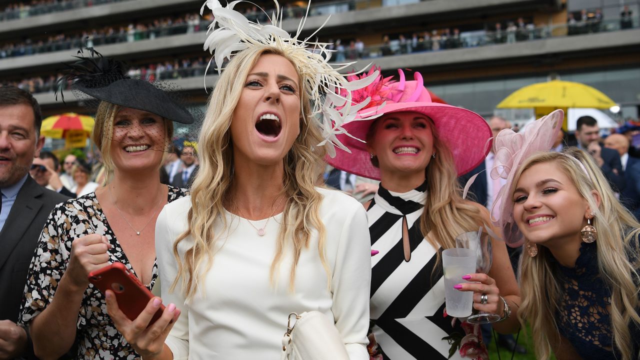 Racegoers cheer on the horses on day two of Royal Ascot.