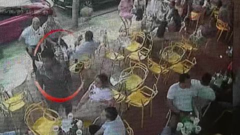 Surveillance camera video shows Sixto Fernandez arriving at the club.