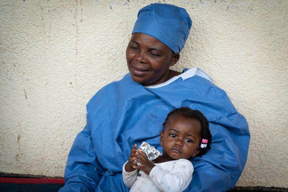 Ebola survivor Masima Masema is looking after 7-month old Airelle while the girl's  mother seeks treatment. "I got sick from Ebola and now I am better. That is why I am taking care of this child. I know how bad this disease is," she says.