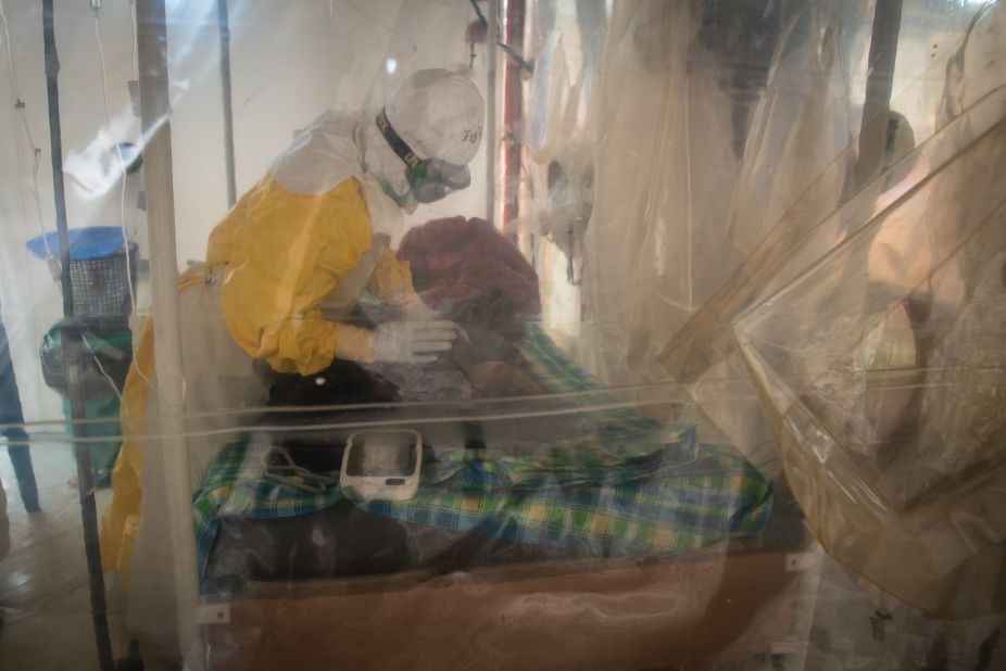 Inside the cubes, nurses and doctors still wear protective gear, even though they have all been vaccinated. If patients come early, there are therapeutic treatments that give them a chance. But almost 70% of Ebola victims have died in this outbreak, many before they even got to a treatment center.