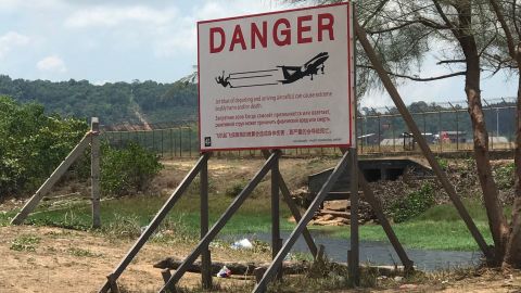 Signs posted at Phuket's Mai Khao Beach warn visitors of the dangers of getting too close to the arriving/departing jets. 