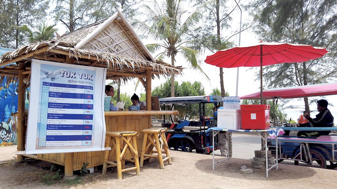 A tuk-tuk hire stand offers cheap transport to the plane spotting portion of Mai Khao Beach.