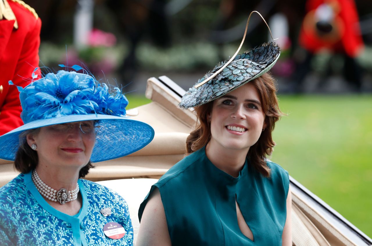 Like a number of other British royals at this year's event, Princess Eugenie, right, embraced a blue color palette. 