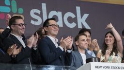NEW YORK, NY - JUNE 20: Stewart Butterfield (C), co-founder and chief executive officer of Slack, and Allen Shim (2nd L), chief financial officer of Slack, ring the opening bell the New York Stock Exchange (NYSE), June 20, 2019 in New York City. The workplace messaging app Slack will list on the New York Stock Exchange this morning. NYSE set the reference price for the direct listing at $26 per share late on Wednesday. (Photo by Drew Angerer/Getty Images)